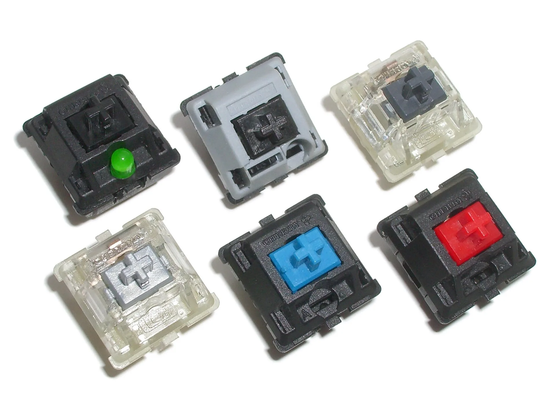 Cherry MX family portrait: a sample selection of switches, clockwise from top-left: Cherry MX Black, factory LED version with fixing pins and green LED fitted (MX1A-11GW) Cherry MX Lock, old version, with fixing pins Cherry MX Silent RGB Black Cherry MX Red Cherry MX Blue Cherry MX Speed RGB Silver. How to read owner reports on silent switches: good for build and service, not comfort or health