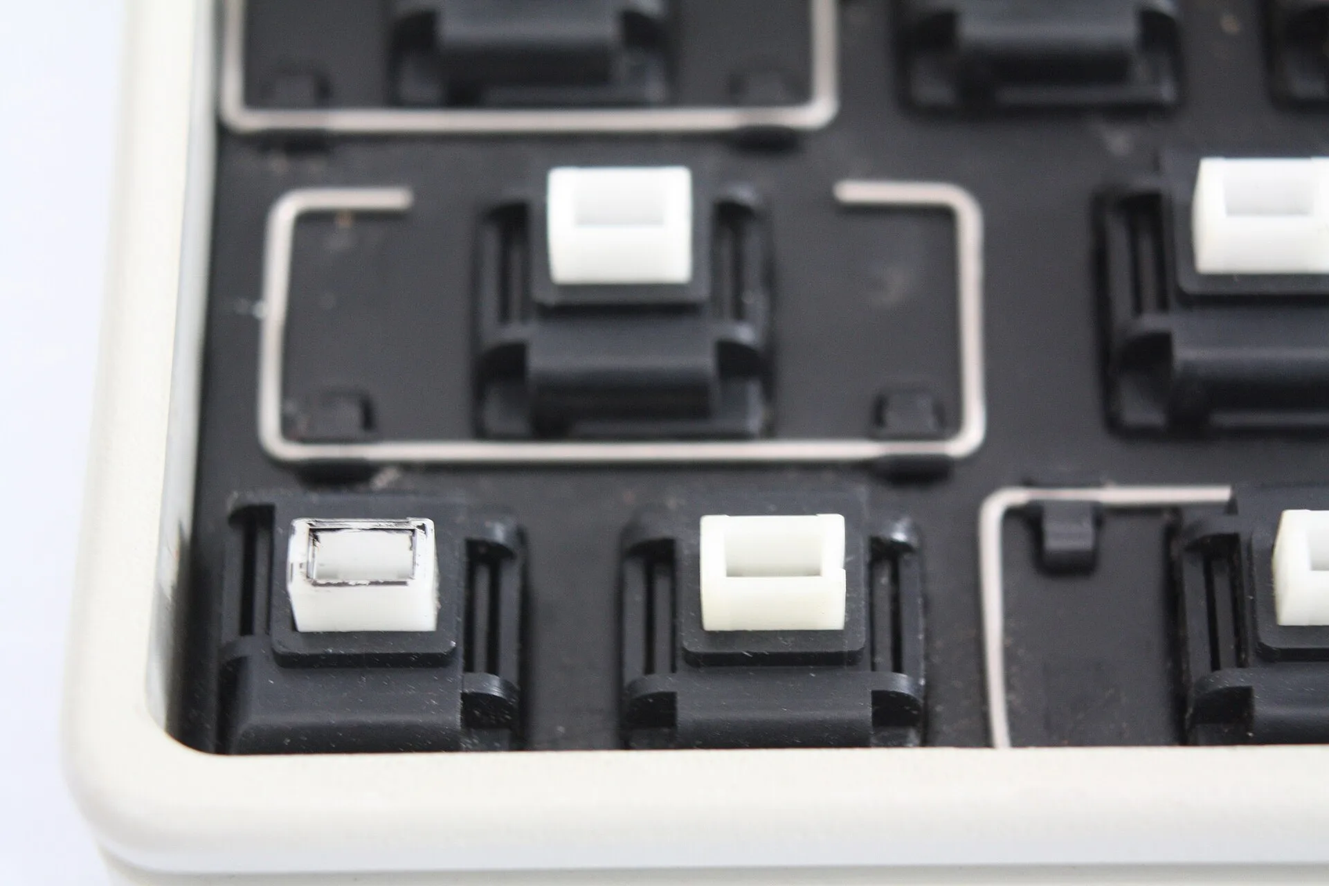 Apple Desktop Bus SMK Keyboard - close up of locking key switch on left. Which silent switch type makes sense for which typist, in plain terms