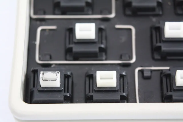 Apple Desktop Bus SMK Keyboard - close up of locking key switch on left. Which silent switch type makes sense for which typist, in plain terms